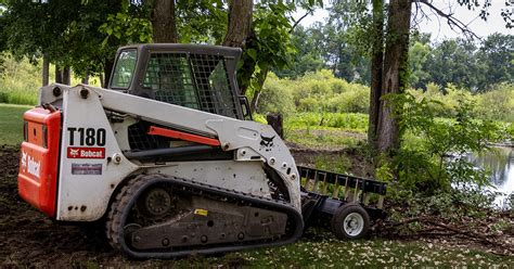 seeding over compacted soil from skid steer|Ground Prep Around a Pond with Skid Steer Attachments.